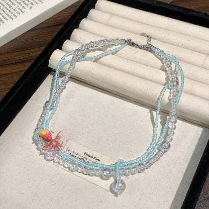 Collana di perline vintage con pesce rosso