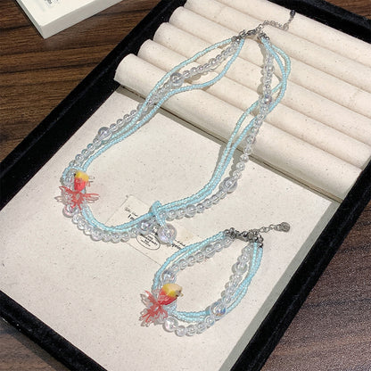 Collana di perline vintage con pesce rosso