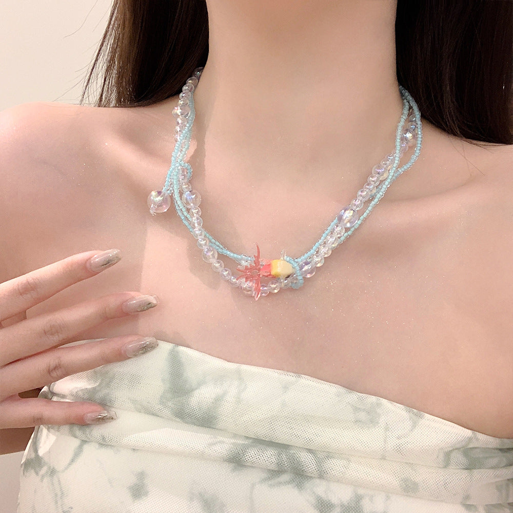 Collana di perline vintage con pesce rosso